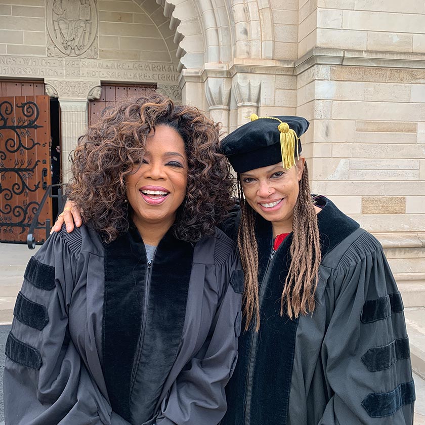 France Winddance Twine alongside Oprah Winfrey outside a graduation ceremony.