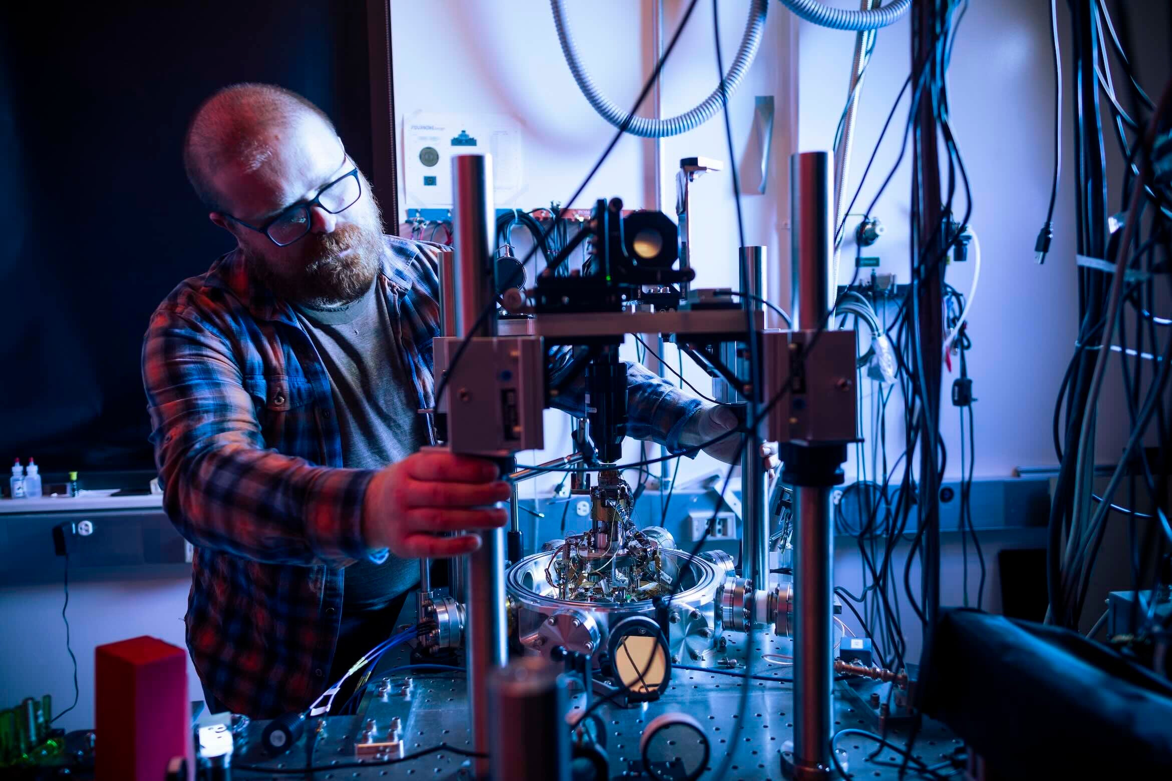 Researcher working with technical equipment in a lab.
