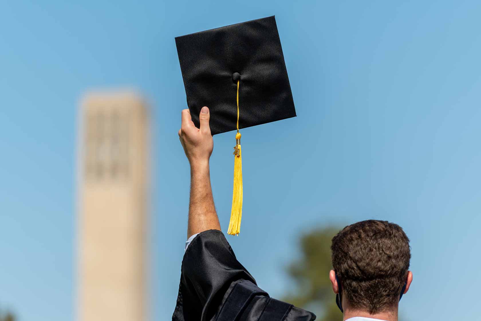graduates in front of Storke Tower