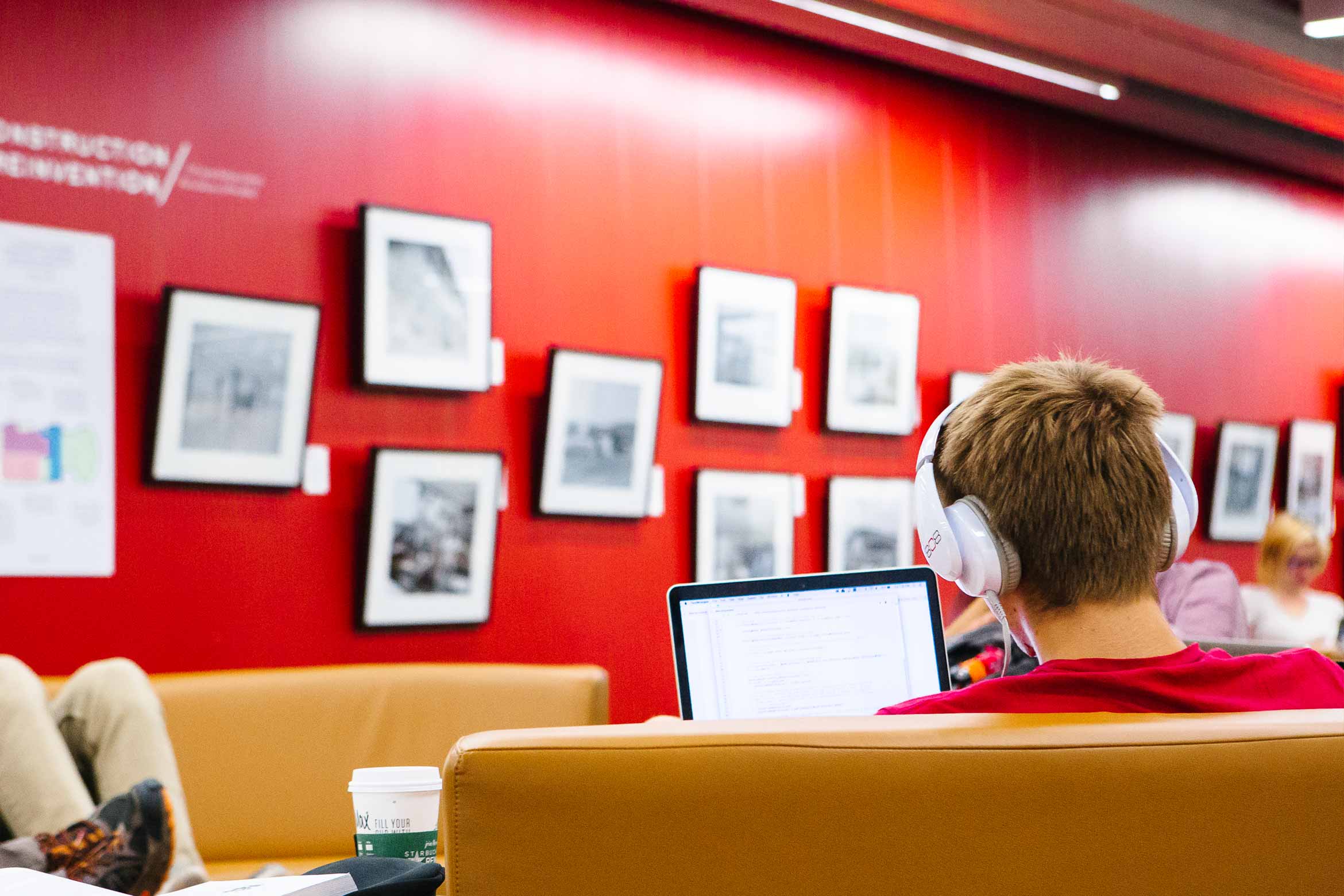 student in library common area