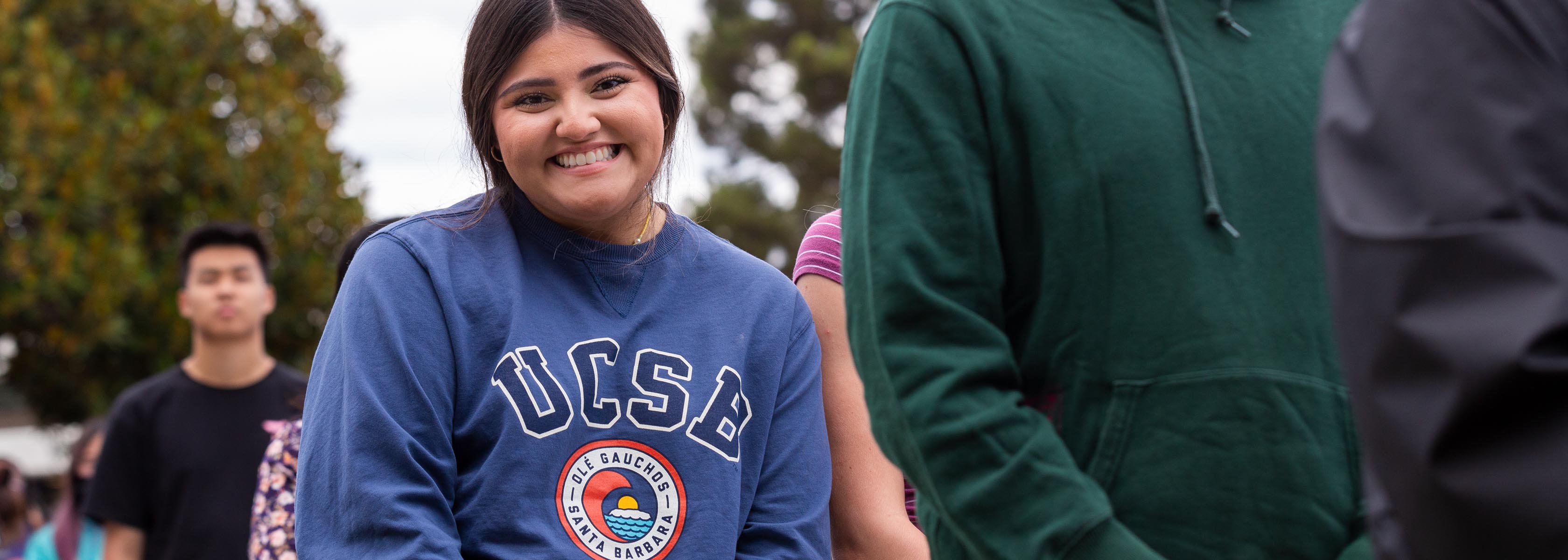 A student with UCSB sweat shirt