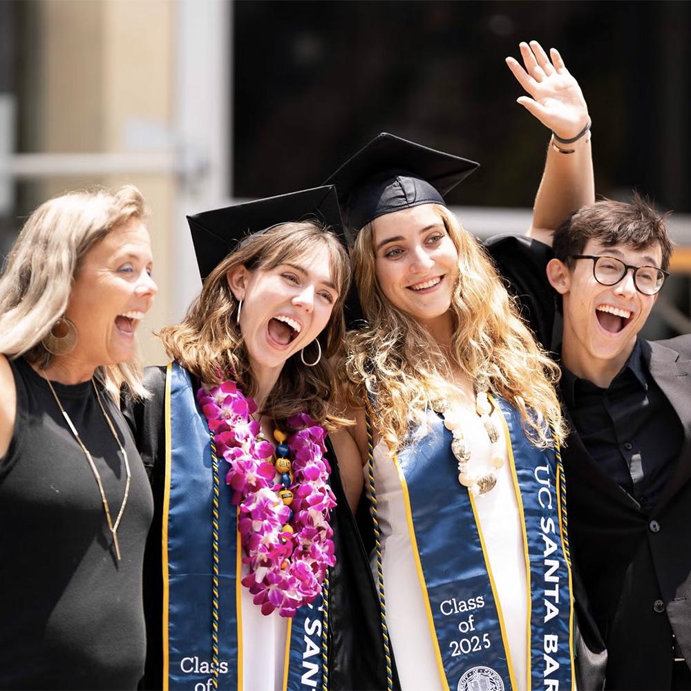 Graduates pose with their family